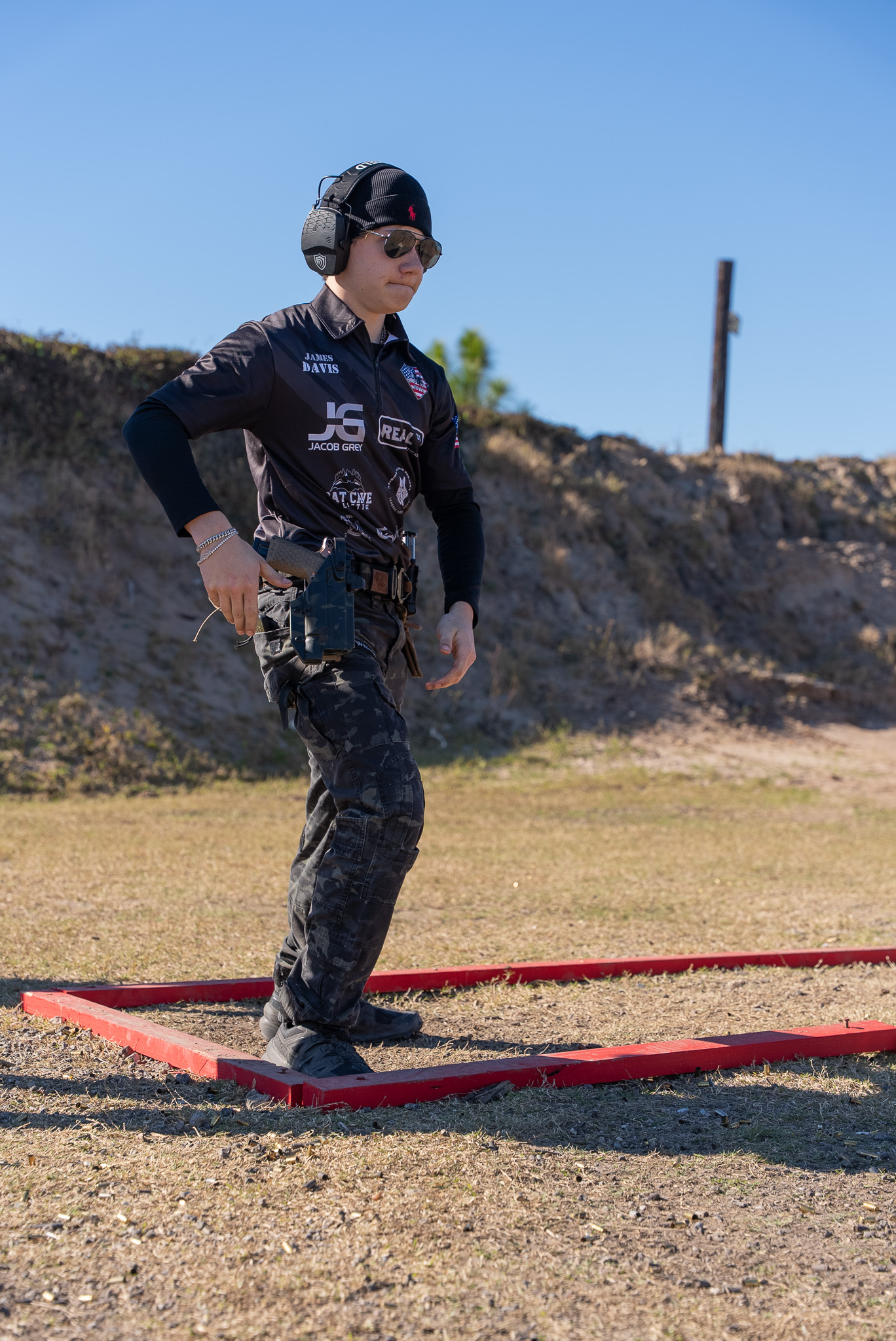 Competitor running pistol stage