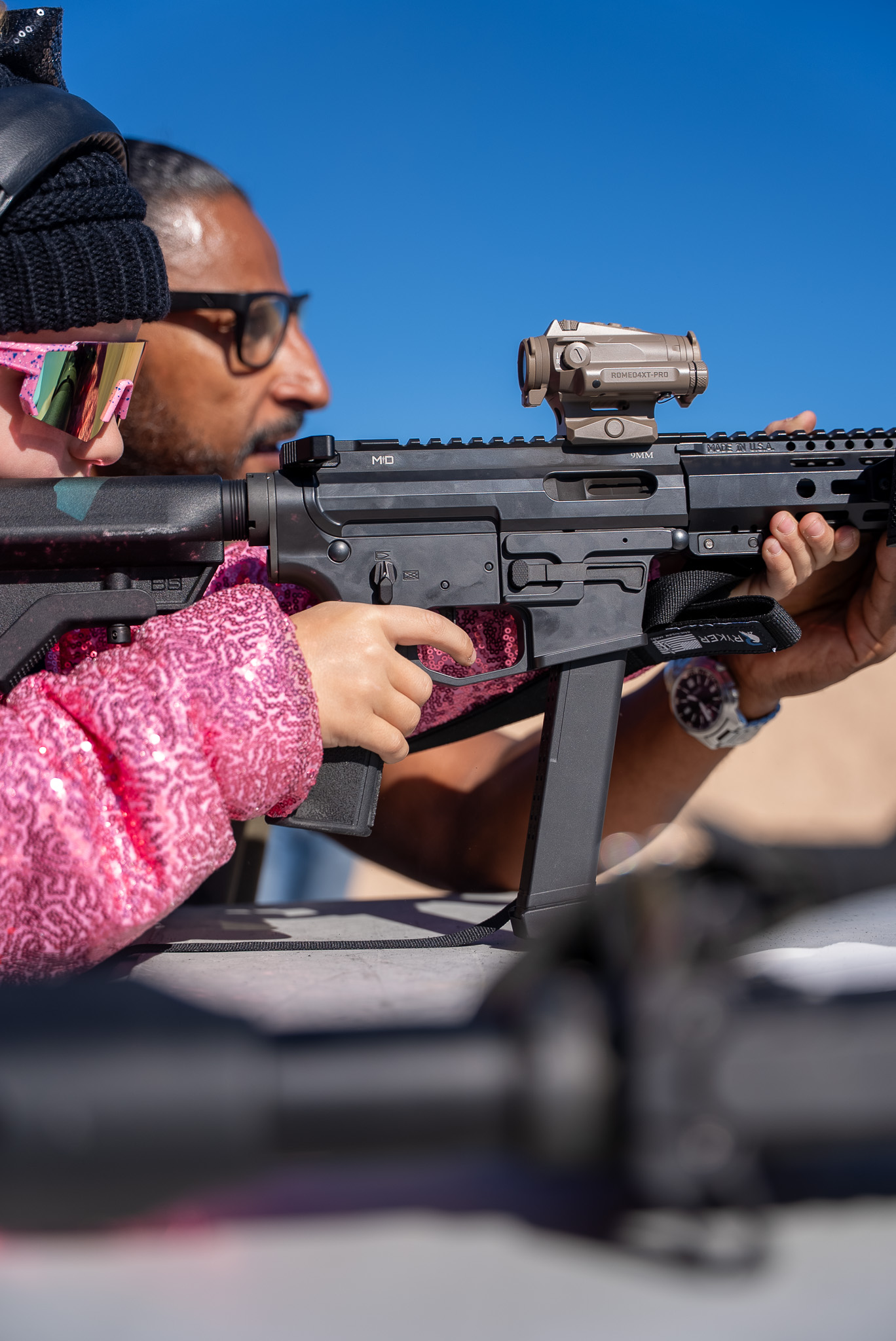 Competitor aiming rifle at competition